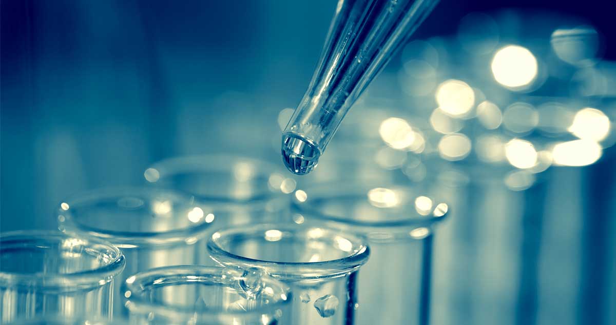 Laboratory dropper dispensing liquid into test tubes for anti-ageing peptides for skin rejuvenation.