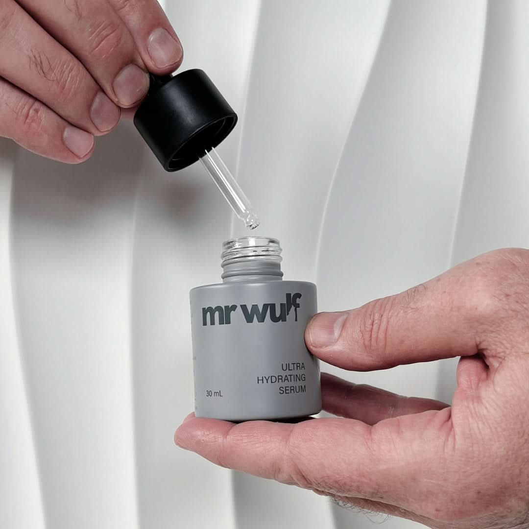 Mr WULF ultra hydrating face serum for men open bottle and dropper close-up showing lightweight serum texture.