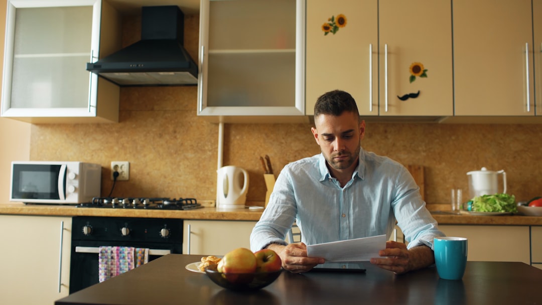 Man pouring coffee at home kitchen island