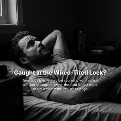 Man lying in bed looking tired, caught in wired-tired lock, experiencing exhaustion and restlessness.